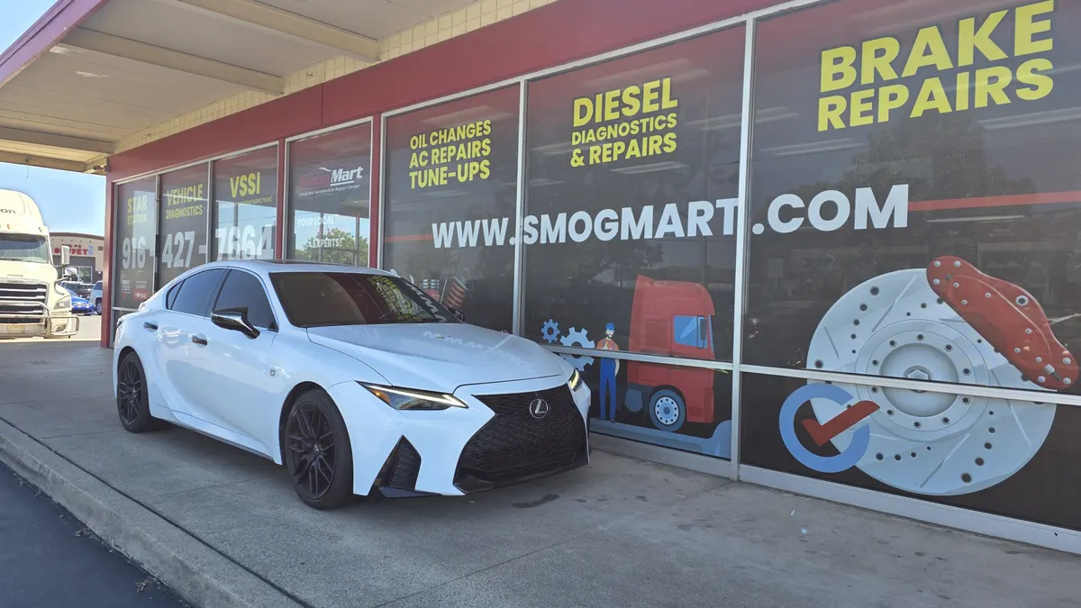 Customer sedan at Smog Mart on Stockton Blvd