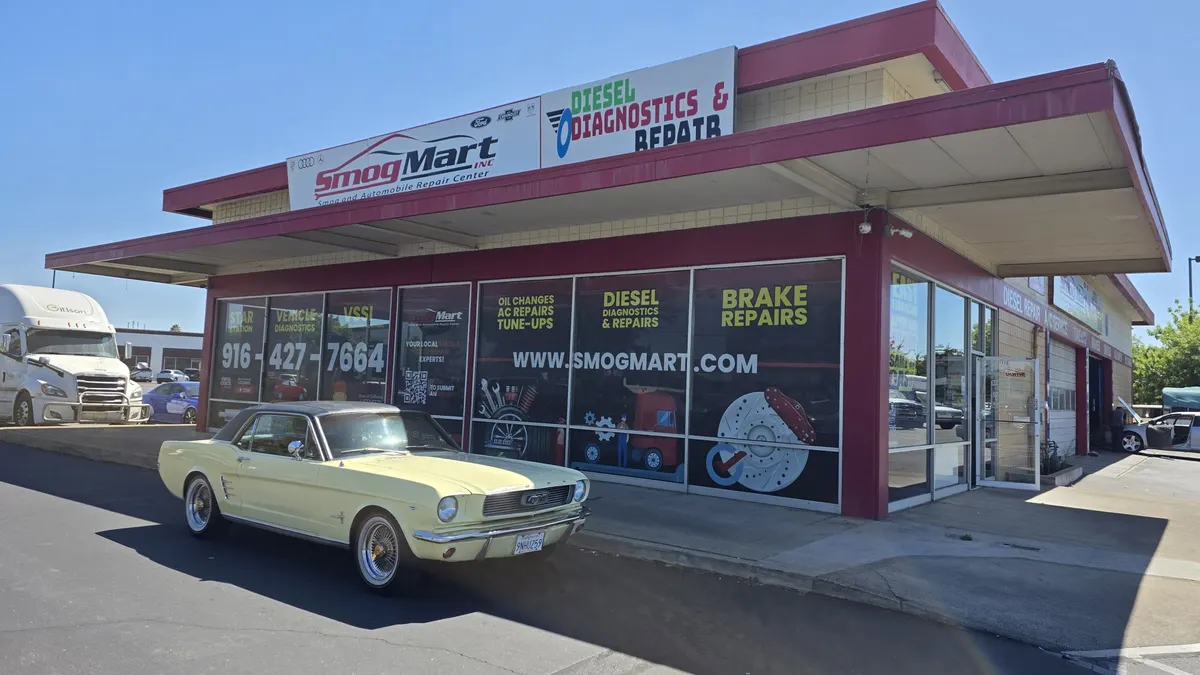 Customer car parked outside the Smog Mart bays on Stockton Blvd, Sacramento