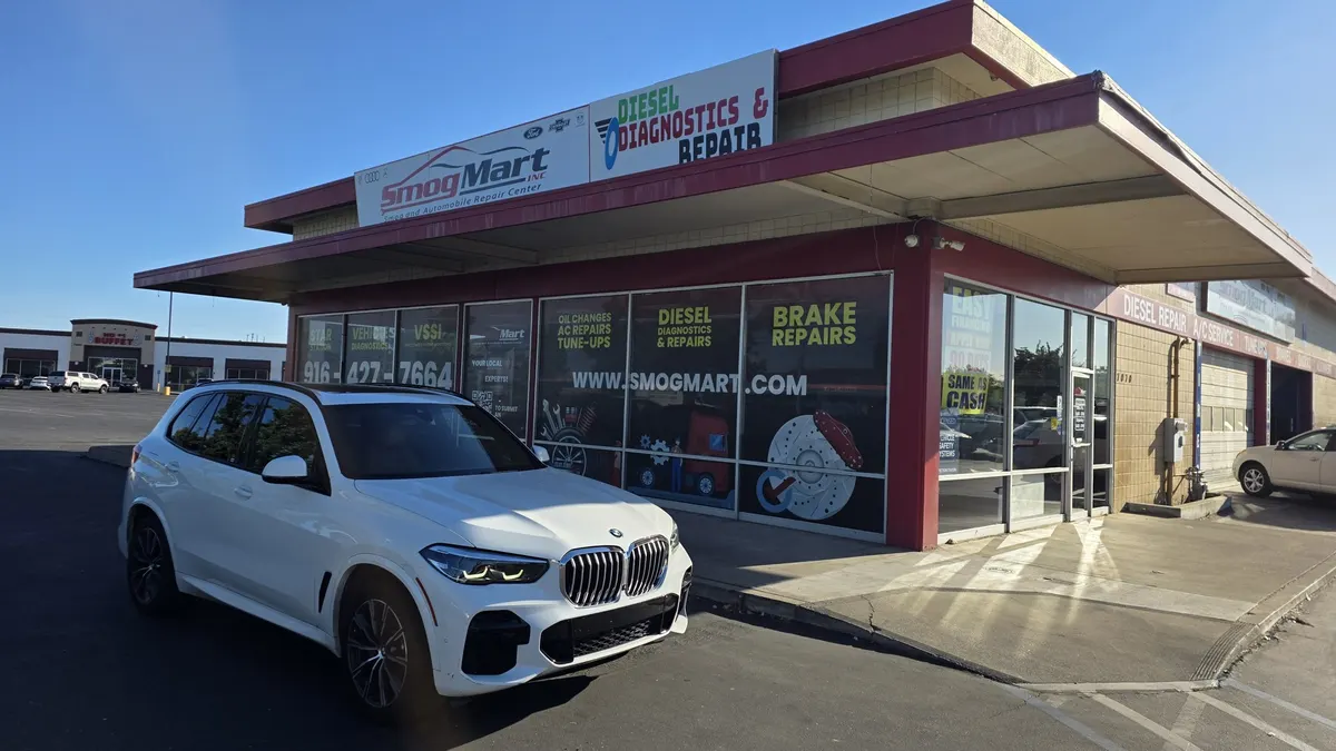 Customer vehicles at Smog Mart in Sacramento