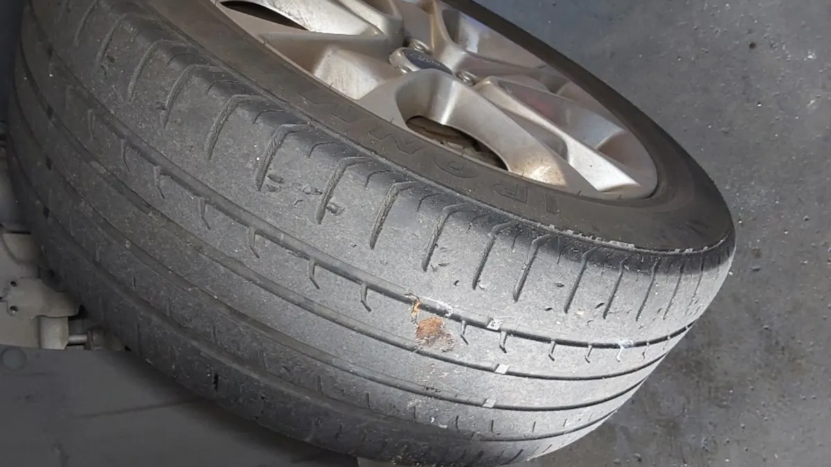Tire tread inspection at Smog Mart