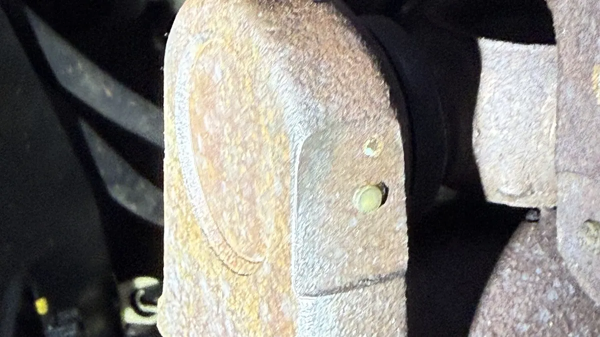 Brake caliper on a Ram 3500 in the Smog Mart bay