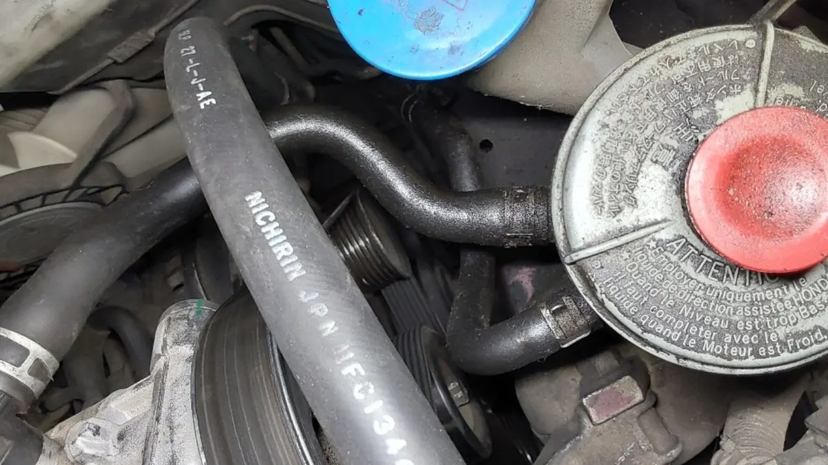 Coolant reservoir and hoses inspected at Smog Mart