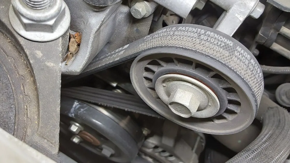 Serpentine belt and pulleys on a customer engine at Smog Mart